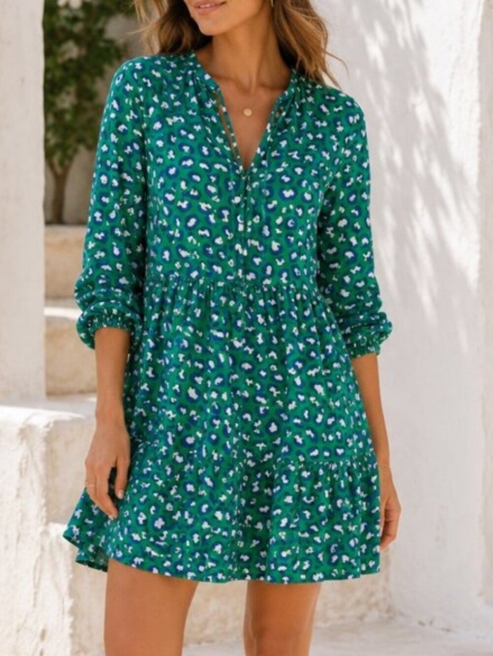 Grace Atwood  dress features a green and blue animal print with a V-neck Sz M